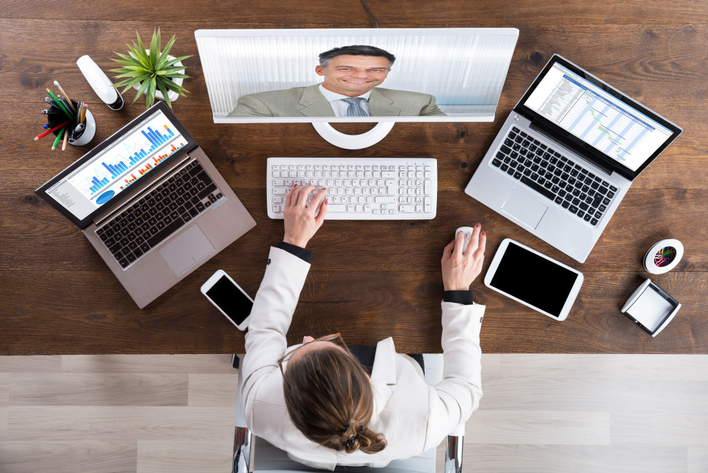 Business people connecting through video conferencing