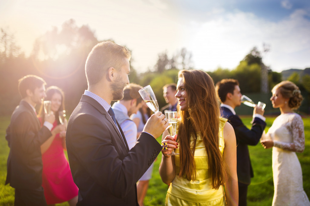 wedding guests drinking champagne